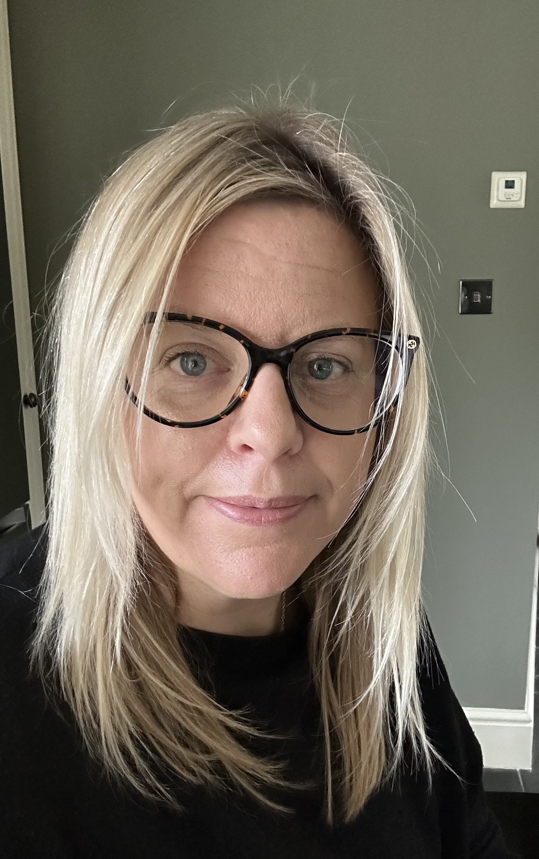 Woodwind instruments lined up next to music stands.
