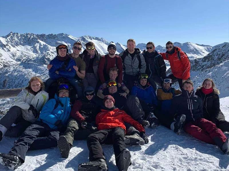 Bristol Royal Naval Unit standing in front of mountains on a ski trip