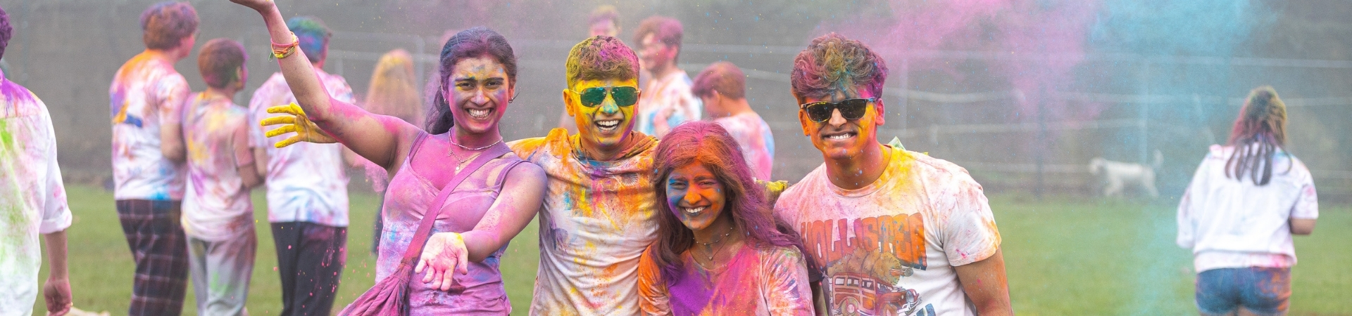 students smiling for camera at a colour run event