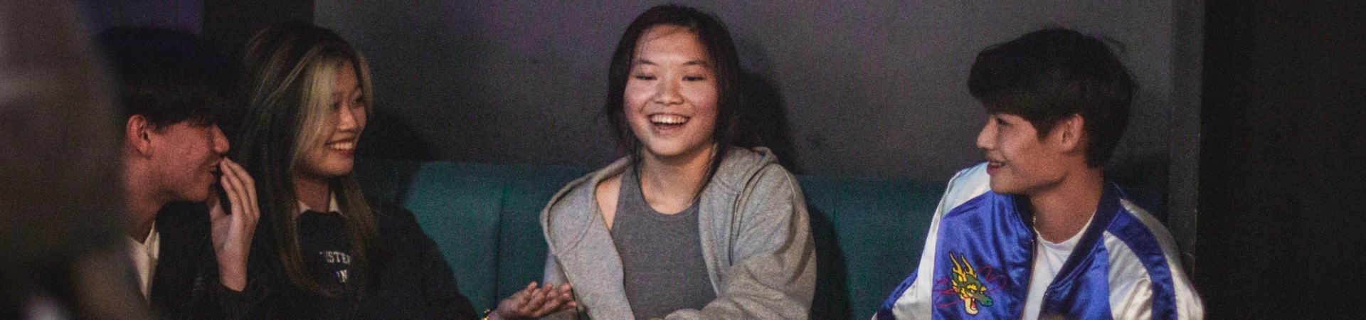 Students smiling in the bar