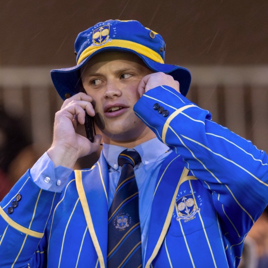 Guy on phone wearing all blue