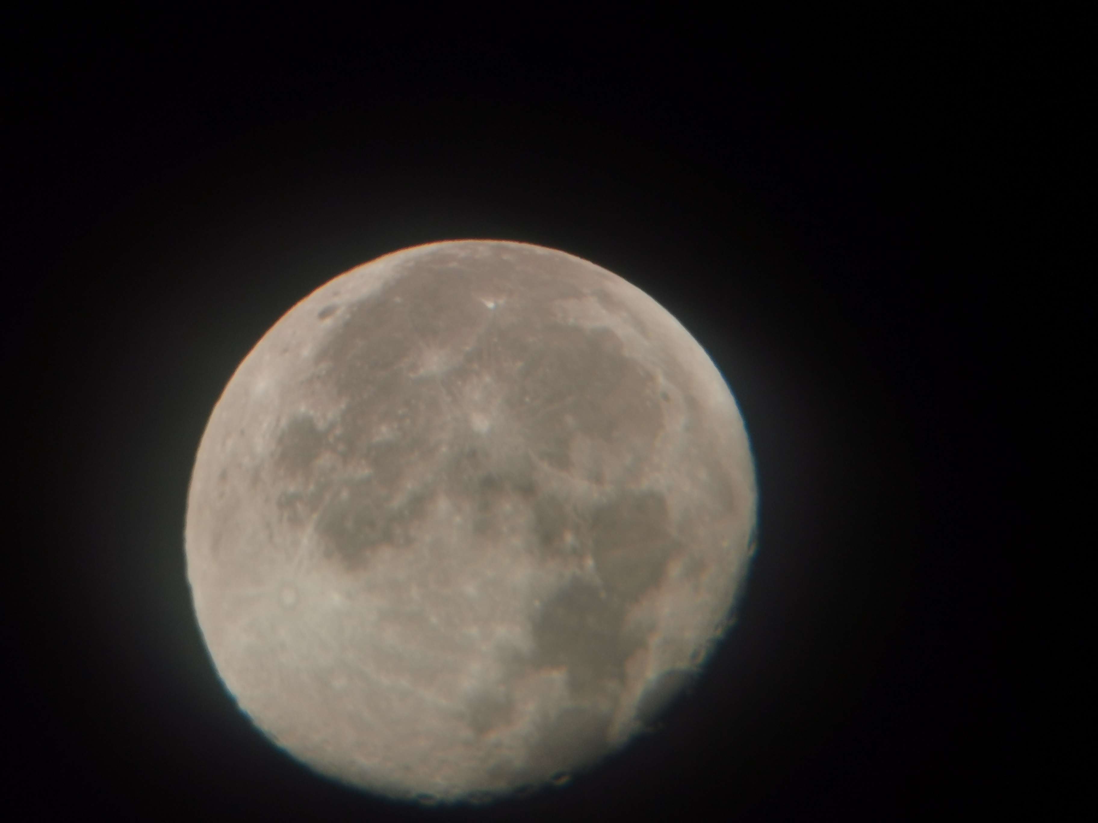 A nearly full moon photo.