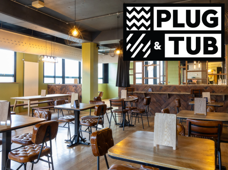 Inside the Student union bar with the plug and tub logo on top