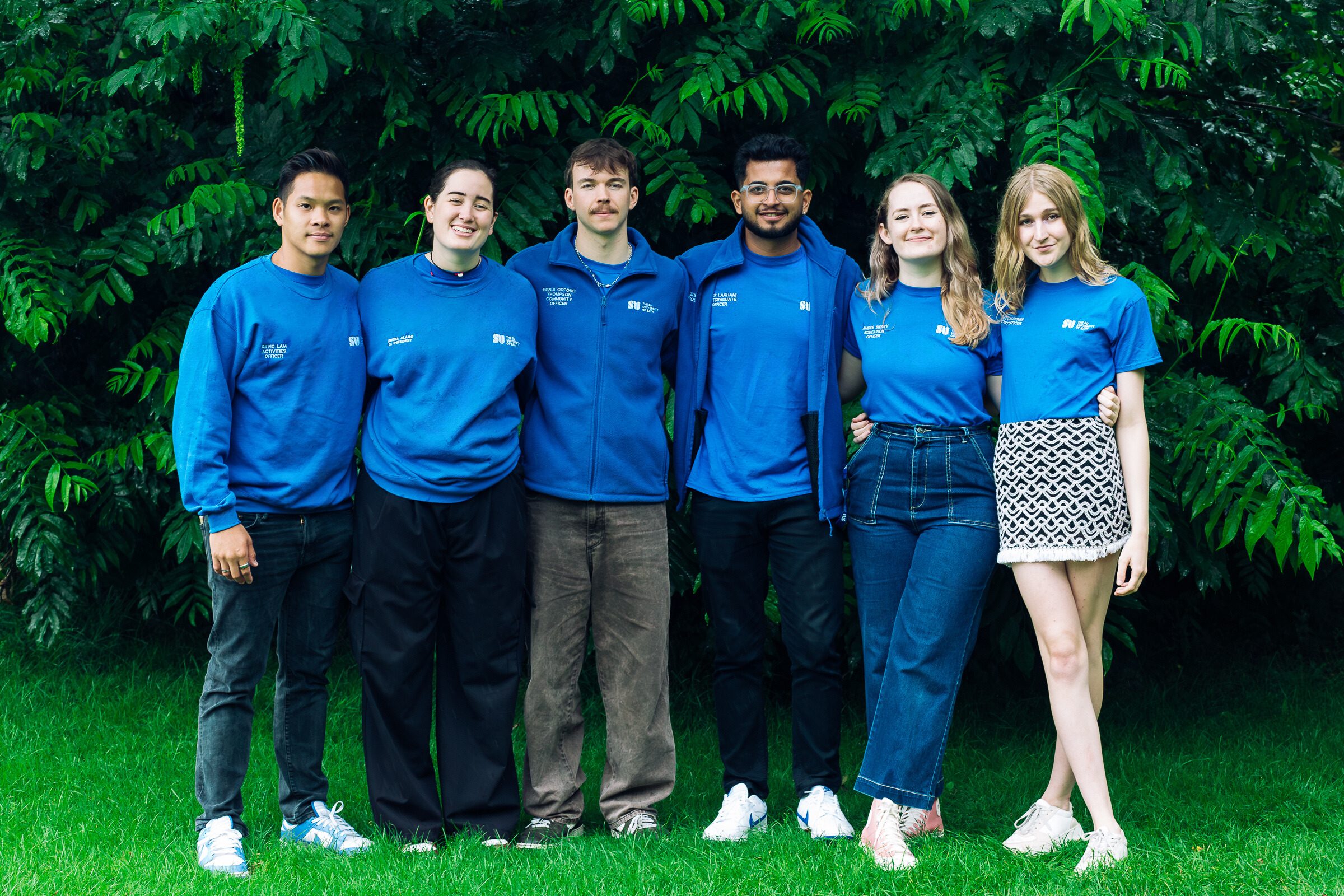 the SU officer team in front of the SU building